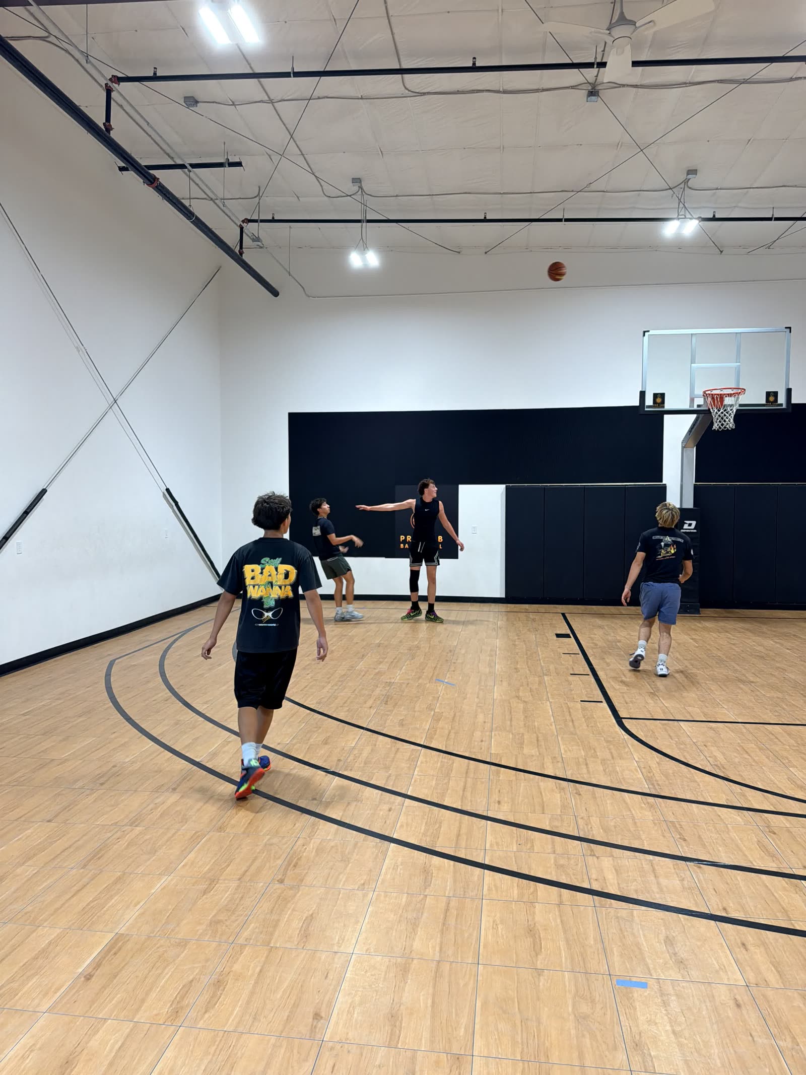 Kids playing a small-sided game in a Sage Hoops group session